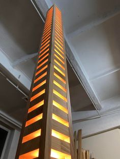 a tall wooden tower with some lights on it