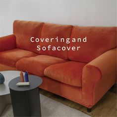 an orange couch with the words covering and sofaer on it's side table