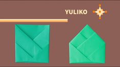 an origami piece with the words yuliko on it and two pieces of paper next to it