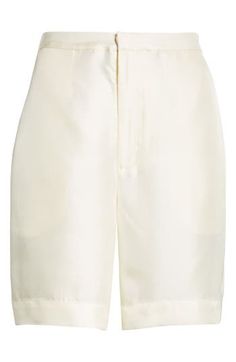 Chloé Harrouche's exacting elegance pervades handsome shorts tailored from silk twill with an elastic-eased high waist. Zip fly with hook-and-bar closure Back elastic waist Side-seam pockets; back welt pockets 100% silk Machine wash, dry flat Imported Designer Clothing Loulou Studio, Summer Wardrobe Essentials, Wedding Guest Shoes, Sports Blazer, Silk Shorts, Baby Boy Shoes, Hair Fragrance, Made Clothing, Denim Leggings