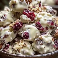 a bowl filled with cranberry salad on top of a table