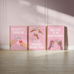 three pink canvases with hand prints on them, one saying happy hour and the other saying