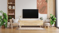 a living room with wooden furniture and a flat screen tv mounted on the wall above it