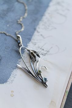 ITEM DESCRIPTION: The size H 5 cm x W 3 cm (2 x 1 1/3 inch). Weight - 3 g. You can buy it with a silver chain or without it. I made this spring flower pendant of sterling silver, blue topaz, and peridot. Silver snowdrop looks gentle and elegant. It will be a great addition to your jewelry collection. Expect many compliments on this! This handmade necklace will come to you in a gift box - ready for gifting. The parcel will be sent during 1-2 days after payment. Delivery usually takes 10-21 days. Nature-inspired Silver Teardrop Jewelry, Silver Nature-inspired Necklace With Flower Charm, Nature-inspired Sterling Silver Teardrop Pendant Jewelry, Silver Necklace With Nature-inspired Flower Charm, Unique Drop Necklaces For Gifts, Nature-inspired Flower Charm Pendant Jewelry, Sterling Silver Flower Pendant Necklace, Unique Silver Flower Pendant Necklace, Unique Drop Necklace With Large Pendant