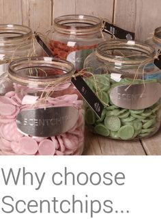 several jars filled with different types of candies on top of a wooden table next to a sign that says, why choose scientch?