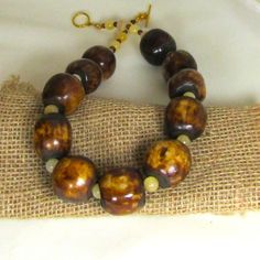 Big Bold Brown Bone Bead Necklace Cheap Brown Beaded Necklaces With Gold Beads, Cheap Brown Beaded Necklace With Gold Beads, Cheap Handmade Brown Beaded Necklaces, Cheap Brown Artisan Necklace, Cheap Artisan Brown Necklace, Cheap Brown Beaded Necklaces With 8mm Beads, Cheap Brown Beaded Necklaces For Festivals, Cheap Brown Faceted Beads Necklace, Cheap Brown Beaded Costume Jewelry Necklaces