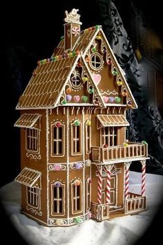 an image of a wooden doll house in the snow