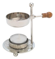 a silver plate with a candle in it and a wooden handle on the top that is holding a tea light holder