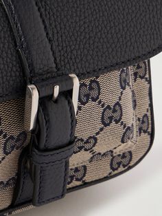 Gucci's 'Neo' messenger bag has been made in Italy from coated-canvas woven with the 'GG' monogram, a now-iconic house hallmark that honours its founder, Guccio Gucci. It's trimmed with leather and has two compartments to keep your cards, phone and keys organised. Messenger Bag For Men, Gucci Collection, Guccio Gucci, Gg Monogram, Canvas Messenger Bag, Messenger Bag Men, Mr Porter, Leather Trims, Hallmark