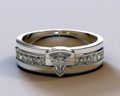 a wedding ring with a heart shaped diamond set in the center and channeled sides