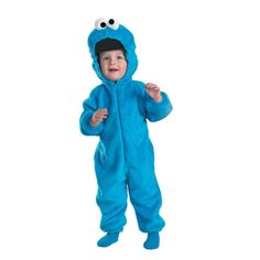 a little boy in a cookie monster costume