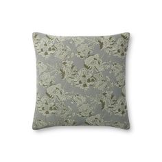 a gray and white pillow with green flowers on the front, sitting on a white surface