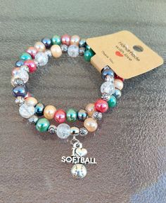 Handmade sports jewelry. Stacked bracelet set, wear together or separate.  Softball bead charm bracelet that comes with colorful glass beads with matching separate bracelet. Handmade.  Low shipping. Other sports and bracelets designs available in our store. Please look at pictures and ask any questions. Softball Bracelet, Glass Bead Bracelet, Sports Jewelry, Bracelet Pearl, Bead Charm Bracelet, Glass Beaded Bracelets, Bracelet Handmade, Bracelet Stack, Bead Bracelet