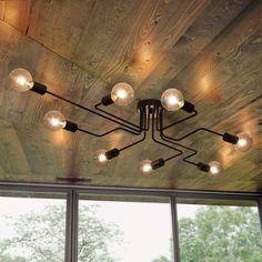 a wooden ceiling with lights hanging from it