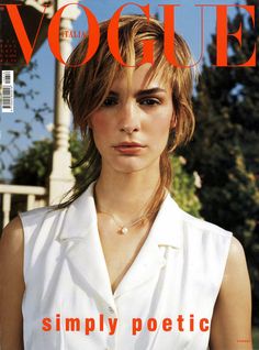 a magazine cover with a woman in white shirt and necklace on her neck, looking at the camera