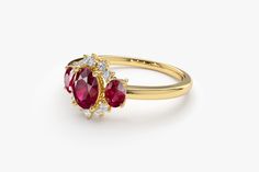 "Ruby Ring / 14k Three Stone Natural Ruby Cluster Ring / Classic Genuine Ruby Engagement Ring 14k Gold / July Birthstone / Promise Ring Features *Made to Order *Gold Kt: 14K (also available in 18K) *Available Gold Color: Rose Gold, Yellow Gold, White Gold *Oval Shape Ruby: 1 pc 6 x 4MM *Oval Shape Ruby: 2 pc 4x3MM *Round Diamonds: 10 pcs 1.55 MM *Ruby CTW: 1.23 ctw *Diamond CTW: 0.16 ctw *Ready to Ship in 7-10 Business Days If you have any additional questions about this product, just hit the \" Yellow Gold Ruby Ring With Halo Cluster Setting, 14k Gold Cluster Birthstone Ring, 14k Gold Ruby Ring With Halo, Yellow Gold Cluster Ring With Gemstone, 14k Gold Cluster Ring With Birthstone, Gold Cluster Ring With Birthstone, Gold Birthstone Cluster Ring, Formal Yellow Gold Three Stone Ruby Ring, Classic Yellow Gold Three Stone Birthstone Ring