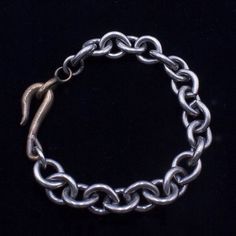 Fusion of tradition and a little edge with our handcrafted Oxidized Sterling Silver and Ancient Bronze Chain Bracelet. Perfect for both men and women, this timeless piece features: Crafted with 11mm link chain followed A touch of ancient bronze with a signature hook clasp. Tailored to fit perfectly, with options for personalized sizing upon request. Elevate your style with this 8" end-to-end bracelet for women and 8.5" for men, ideal for standalone wear or layering with your favorite pieces. Emb Elegant Oxidized Link Bracelets, Elegant Link Bracelet With Oxidized Finish, Formal Bracelet Jewelry With Hooks And Links, Sterling Silver Bracelet With Oval Links, Sterling Silver Bracelets With Hook And Links Classic Style, Classic Handmade Oval Link Jewelry, Classic Sterling Silver Bracelets With Hook And Links, Metal Link Chain Bracelet With Hooks, Timeless Oval Link Chain Bracelet With Sterling Silver Clasp