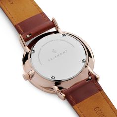 Seizmont from Denmark designs timepieces for men that are effortlessly elegant while being admirably functional. Features a perfectly polished, rose gold-tone super slim case. The second hand is tipped blue for an extra touch of class, and the porcelain white dial, matching up perfectly with the brown genuine leather strap. Japanese quartz powers the movement for infallible precision. Comes in an environmentally friendly storage box. Modern Rose Gold Watch With Analog Display, Modern Rose Gold Watch Accessories For Everyday, Modern Rose Gold Watch For Everyday Use, Modern Rose Gold Watch Accessories With Diamond Hour Markers, Minimalist Dress, Minimalist Dresses, Dress Watch, White Dial, Slim Case