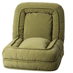 a green recliner chair sitting on top of a white floor next to a pillow