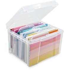 a plastic storage box filled with lots of different colored pens and pencils in it