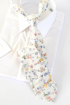 "IVORY Floral Wedding Tie, Mist Floral Men's Tie, Regency Flower Bow Tie, Groomsmen Tie Champagne, Ivory Dress Tie, Pocket Square Tie Ivory IVORY Floral Wedding tie is one of our most favorite groomsmen ties chosen to outfit wedding party. The fine fabric on this necktie gives off the great shine and looks great at any formal or informal gatherings. Even though this regency men's tie is so popular for weddings, it is still an ideal choice for business attire. Great design and texture tie gives y Cotton Ties For Weddings, Fitted Cotton Ties For Wedding, Wedding Cotton Suit And Tie Accessories, Elegant Cotton Suit And Tie Accessories For Wedding, Cotton Wedding Suit And Tie Accessories, White Cotton Ties For Formal Occasions, Classic White Tie For Wedding, Cotton Wedding Tie, Classic White Wedding Tie