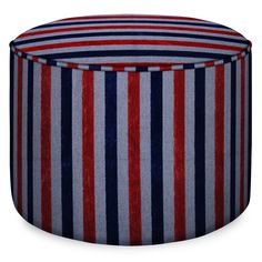 a red, white and blue striped poufce sitting on top of a table