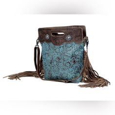 A Classy Handbag With Adjustable Leather Straps And Ample Space To Accommodate Your Essentials. It Has One Zipper Pocket And 2 Side Pouches On The Inside. Item Width 14.5 Item Depth 4 Item Height 14 Shoulder 22 Leather Fringe Purse, Canvas Leather Tote Bag, Brown Fringe, Cross Shoulder Bags, Tooled Leather Bag, Tooled Leather Purse, Canvas Leather Bag, Western Purses, Fringe Purse