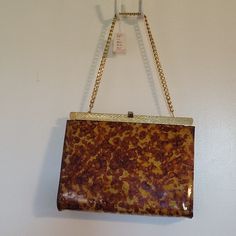 Ladies Animal Print Handbag With Gold Chain Vintage Crossbody Bag With Chain Strap, Brown Square Bag With Chain Strap, Vintage Shoulder Bag With Chain Strap For Travel, Vintage Satchel Shoulder Bag With Chain Strap, Vintage Shoulder Bag With Chain Strap For Everyday Use, Vintage Chain Strap Shoulder Bag For Everyday Use, Vintage Gold Crossbody Bag, Vintage Shoulder Bag With Chain Strap, Brown Rectangular Shoulder Bag With Chain