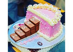 a birthday cake with pink and white frosting