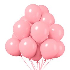 a bunch of pink balloons floating in the air