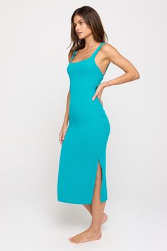 Look back at it. A fitted, mid-length dress. Designed with an interior bra, flattering rounded square neckline, and twist-back design. Made in our light and fluid signature Slim Rib fabric, which offers maximum flexibility, softness, and breathability with compressive support. | Valerie Twist Back Midi Dress in Surf Fitted Midi Dress With Cutout Back, Chic Scoop Neck Seamless Dresses, Chic Seamless Scoop Neck Dresses, Stretch Midi Dress With Cutout Back, Chic Stretch Midi Dress With Scoop Neck, Chic Scoop Neck Midi Dress, Solid Color Midi Dress With Built-in Bra, Chic Seamless Dress With Straight Neckline, Square Neck Stretch Bodycon Dress For Brunch