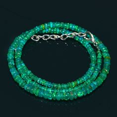 "Natural Ethiopian Green Fire Opal Smooth Rondelle Beads Necklace Gemstone Type : Natural Item Code : 7019 Origin-:100% Natural Green Fire Opal Necklace Grade-: AAA++ Stone shape-: Smooth Rondelle Beads Stone color-: Same As Picture Metal-: Length-: 16 Inch Quantity-: 1 Strand Necklace Approx Weight : 36.70 Carat Approx Size : 3-5 MM 100% Genuine & Natural ABOUT US skgemsstone based in Jaipur, India is a company engaged in supplier, manufacturing, wholesale and retail business of Gemstones ( Fire Opal Green Necklace, Fire Opal Necklace, Green Fire, Necklace Green, Moonstone Beads, Green Opal, Necklace Gemstone, Jaipur India, Opal Necklace