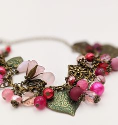 "- Vintage Style Valentines Charm Bracelet Bronze Chain is adjustable from 6.5\" - 8\" with an extension chain The bracelet links are filled with crystals, glass beads and pearls in shades of pink and red Mixed between the beads are vintage style heart charms - all are bronze, some have patina Search my store categories \"Necklaces\" and \"Earrings\" for matching pieces. This is a great gift for Mother's Day Your bracelet will be carefully gift packaged and shipped via USPS First Class Mail. Fee Metal Heart-shaped Beaded Bracelets For Valentine's Day, Heart-shaped Metal Beaded Bracelets For Valentine's Day, Metal Heart-shaped Beaded Bracelet For Valentine's Day, Valentine's Day Beaded Metal Jewelry, Elegant Metal Beaded Bracelets For Valentine's Day, Metal Heart Beads Bracelets For Party, Pink Bracelets With Adjustable Chain For Valentine's Day, Pink Adjustable Bracelets For Valentine's Day, Metal Bracelets With Heart Beads For Party