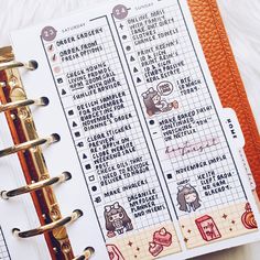 an open planner with stickers on it