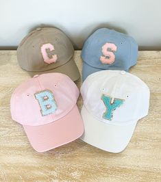 We have had so many request for youth size hats, they are finally here. Youth size baseball Cap with your choice of Varsity Chenille Letter Patch. Patch is applied with industrial heat. These are Youth size!! 100% bio-washed chino twill Unstructured, six-panel, low-profile Pre-curved visor Self-fabric tri-glide buckle closure Tear away label MeasurementsSmall Fit: 6½ - 7¼ Sizes (US)Adjustable (age range: 5 years to small adult) Elena Belle, Monogramming Ideas, Womens Ball Caps, Cricut Projects Easy, Purple Petunias, Kids Baseball Caps, Monogram Hats, Creative Dates, Varsity Letter