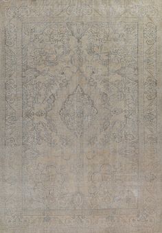 an antique rug is displayed on a white surface with grey accents and designs in the middle