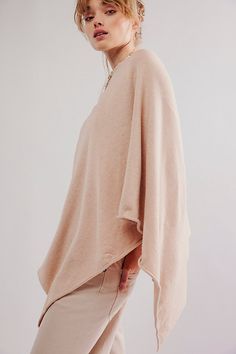 The perfect minimalist layer, this floaty poncho features a classic triangle hem and cowl neckline for effortless style. **Fit:** Relaxed **Features:** Pull-over style, triangle hem, cowl neckline, open sides, relaxed sleeves **Why We | Simply Triangle Poncho Jacket by Free People in Tan Poncho Jacket, Cowl Neckline, Boho Clothing, Boho Outfits, Effortless Style, Top Brands, Free People, Luxury Fashion, Clothes