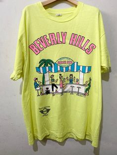 "Vintage 90s Beverly Hills Shirt Size: XL Made In USA Measurements are taken with the garment laying flat. Chest width: 23\" Body Length : 29.5\" Condition: Pre-owned 8/10 Material: 100% Cotton Comment Stain like pic No refund. -Payment : accept paypal only -Shipping : to shipping worldwide by registered airmail (small package) Thai post registered. receiving the item within 7-30 business days non sat-sunday working after payment cleared  (some case in Australia/italy/spain/north and south america 2-4 weeks) I ship every day, monday through Friday! Many times your item will go out same day!! Get your stuff super fast when you buy from me! -Check item status out of my country: http://track.thailandpost.co.th 11C" 90s Beverly Hills, 90s Graphic Tees Vintage, Vintage Beverly Hills, Genderqueer Fashion, Comfy Fall Sweaters, Official Dresses, La Dispute, Patagonia Shirts, Graphic Tees Vintage