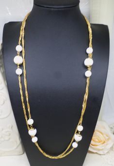 Elegant White Beaded Chain Necklace, Elegant White Round Beads Chain Necklace, Elegant White Chain Necklace With Round Beads, White Pearl Chain Necklace With Round Beads, White Metal Beaded Necklaces With Beaded Chain, White Beaded Long Chain Necklace, White Beaded Necklace For Party, White Beaded Necklaces With Round Beads And Chain, White Long Costume Jewelry Necklace