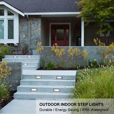 a house with steps leading up to the front door and grass growing on the side