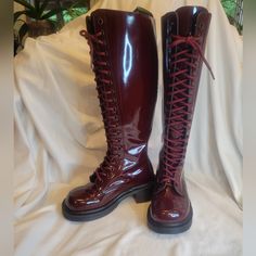 Like New Authentic 90s Vintage Doc Martens. Oxblood Patent Leather Knee High 20 Eyelet Lace Up Boots With 1.5" Heel. Made In England. Real Leather. Soles Have No Signs Of Wear. They Do Have Some Creases And Some Small Scuffs And Scratches. There Are A Few Spots Of Discoloration, Mostly Not Seen When Being Worn. Photos Show All Damage, Scuffs, Etc. They Are In Truly Incredible Condition For Their Age! Laces Are Original And Fully Intact With No Fraying. These Boots Are Absolutely Gorgeous And Ver Red Lace-up Leather Boots, Vintage Doc Martens, Black Lace-up Boots With Red Sole, Red Lace-up Leather Moto Boots, Dark Red Doc Martens, Red Leather Lace-up Boots With Round Toe, Vintage Dr Martens, Eyelet Lace, 90s Vintage