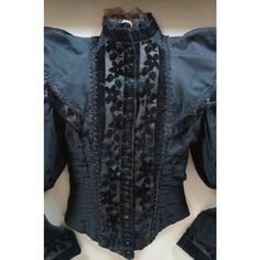 Impressive pair of circa 1890's Victorian women's dress tops. One elaborately layered black lace / mesh shirtwaist with leg og mutton / gigot sleeve. And one black bodice / jacket in cotton with floral burnt velvet accents at the cuffs, collar and placket, corded foliate detail at the cuffs, waving beaded trim and shiny black buttons. Mounted on off white fabric in contemporary carved champagne gilt shadowbox frames.  Dimensions: 30" x 4.25" x 30" (Width x Depth x Height) Fitted Victorian Dress Costume, Long Sleeve Victorian Dress For Party, Victorian Long Sleeve Dress For Party, Gothic Victorian Dress For Formal Occasions, Fitted Victorian Historical Dress, Victorian Fitted Ruffled Blouse, Victorian Fitted Ruffle Blouse, Fitted Victorian Blouse With Ruffles, Fitted Gothic Victorian Dress With Lace Trim