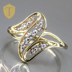 This vintage 10K gold bypass ring features elegant diamond accents that add a touch of sparkle to its graceful, curving design. Weighing 2.2g and sized at 8.5, the ring offers impressive finger coverage of 16.5mm with a rise of 5.1mm, giving it a bold yet refined look. Marked "10k" and in great condition, this bypass ring combines vintage charm with a unique design, perfect for those who appreciate both style and sophistication. Karat: 10K Weight: 2.2 g Size: 8.5 Approximate measurement: Coverage: 16.5 / Rise: 5.1 Stone(Approx. Size): Diamond Accent  Marking: 10k  Condition: Great Approx. Era: Vintage  DELIVERY Our shipping and handling is always fast & free unless otherwise stated. Once an order is placed and payment is received, all items are shipped within one business day, excluding we Bypass Ring, Ladies Ring, Curve Design, Vintage Ring, Ring Vintage, 10k Gold, Rings Statement, Vintage Charms, Women Rings