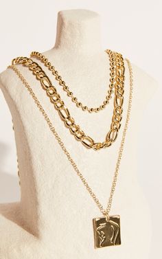 Add a cool-girl touch to your new season 'fits with our Miranda Necklace! This chic and minimalistic layered necklace features a beaded ball chain, a figaro chain and a dainty chain with a square pendant. It's such a sleek piece that'll round out your looks without fail. Style it with a cropped blazer, a mini skirt, heeled sandals and a baguette bag for a chic look!Product Details  Layered necklace  Set of three  Short bead chain necklace  Medium figaro chain necklace  Long dainty chain with squ Bead Chain Necklace, Beaded Ball, Figaro Chain Necklace, Layered Chain Necklace, Layered Chain, Layered Necklace Set, Dainty Chain, Layered Chains, Figaro Chains