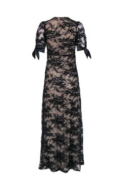 Get some dark lace in your closet today with this romantic gown from Night Cap! Made with a satin trim, this is a fitted-to-perfection frock to wear with all your favorite strappy sandals and a smudged dark lip for some gothic style that is sure to shake up any evening. Size XS 89% Polyamide, 8% Elastane, 3% Viscose V-neckline Short sheer sleeves with satin ties Lace overlay with contrasting lining Material provides stretch, no closures Waist 24" Bust 28" Total length 56"