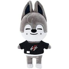 a stuffed animal with a t - shirt on it's chest and ears,