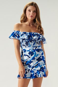 Cool like the sea, this blue abstract floral print embodies the perfect top for a warm day out to brunch. It features an off the shoulder design with a ruffle detail that sweeps from shoulder to shoulder. The bodice is fully smocked to create a flattering fit that ends right at the hips. Wear it with bottoms of your choice or complete the coord set with the matching skirt.- Smocked- Off the shoulder- Ruffle detail- Color: White BlueSize + Fit - Model is 5'9" and wearing size XS- Measurements tak Summer Floral Print Pool Tops, Summer Floral Print Top For Pool, Blue Tops For Pool Occasions In Spring, Off-shoulder Beach Top With Smocked Back, Summer Ruched Off-shoulder Smocked Top, Off-shoulder Tops With Smocked Back For Beach, Spring Beach Off-shoulder Smocked Top, Chic Beach Smocked Top With Floral Print, Summer Off-shoulder Smocked Top For Beach