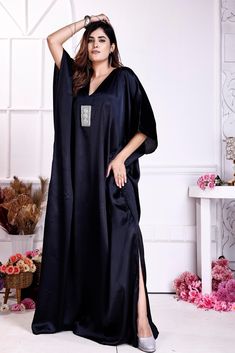 "\"Step into the spotlight with our exquisite Black Embellished Satin Kaftan for Women. Crafted from luxurious satin fabric, this kaftan exudes opulence and glamour. The intricate embellishments add a touch of sophistication, making it perfect for special occasions or evenings out. With a flattering silhouette and a comfortable fit, this kaftan is a must-have addition to your wardrobe, ensuring you stand out with style and grace.\" ONE SIZE FIT ALL KAFTAN   ( Small to 8XL)   Regular Kaftan Length 60\"  Material: satin  Quality: Excellent (Best Quality On Our Stock) Ready Stock Items We ship Same Day World Wide You will get within 4-5 working days.  Product Details: Condition : - Brand New  Brand       : - Silk Kaftan Type         : - Kaftan Shipping :- DHL Express / FedEx Priority" Traditional V-neck Evening Kaftan, Formal Festive V-neck Kaftan, Luxury Silk Kaftan For Party, Evening Embellished Silk Kaftan, Evening Silk Embellished Kaftan, Elegant Embellished Thobe For Party, Luxury Floor-length Party Kaftan, Embellished Evening Thobe For Eid, Luxury Party Floor-length Kaftan