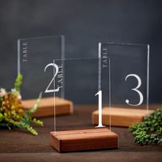 two clear acrylic blocks with numbers on them