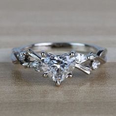 an engagement ring with three pear shaped diamonds